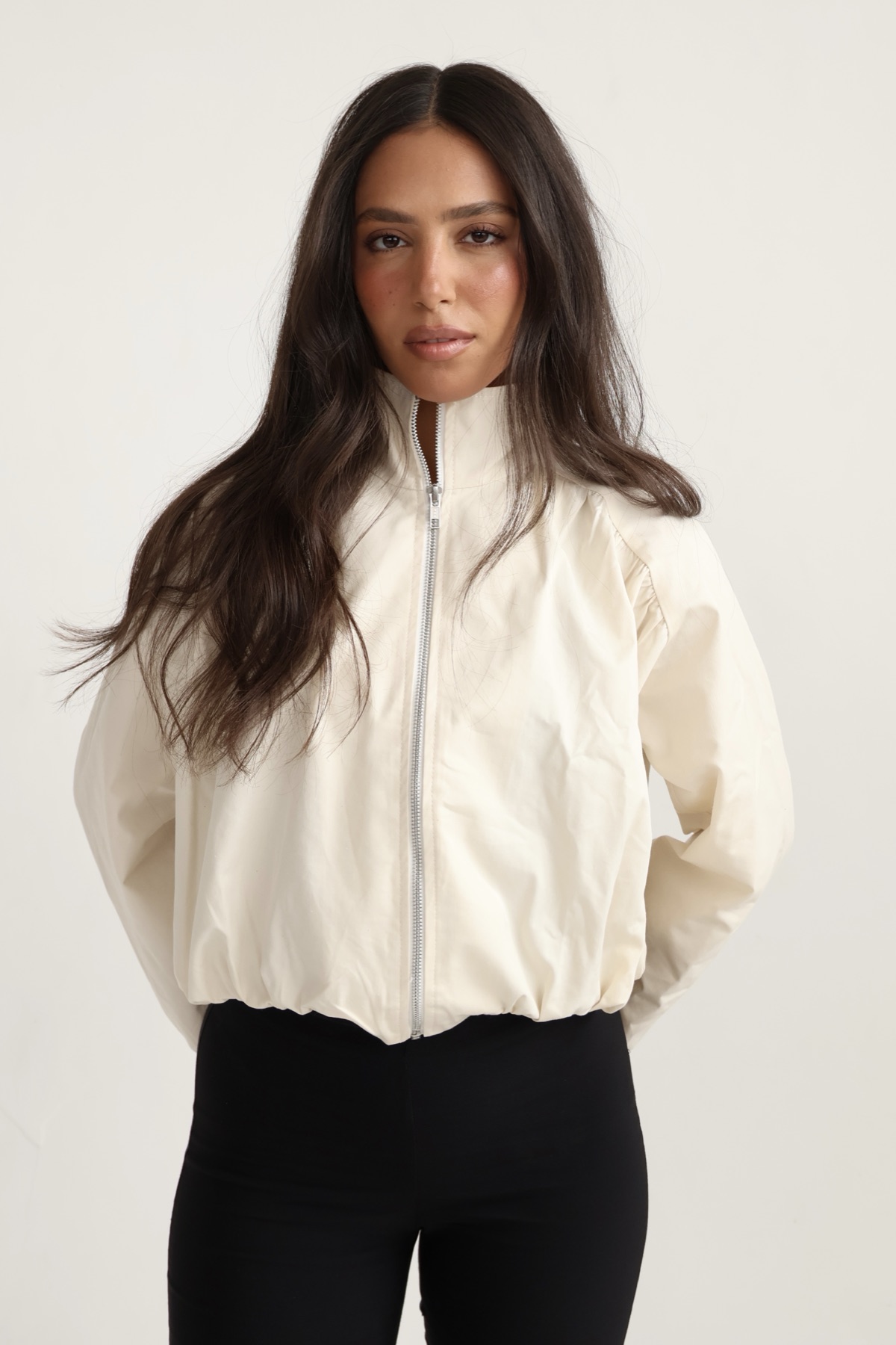 Noy Shoushan, founder of BY NOY SHOU, in a cream zip jacket